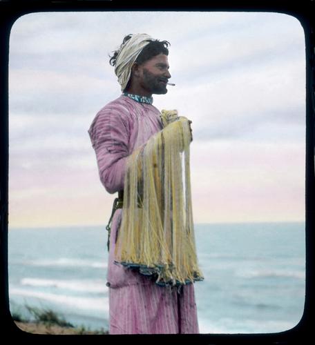 Arab fisherman on the Askalon coast. Holding his throw-net.