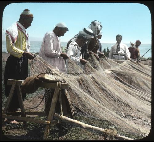 Fishermen mending their Nets.